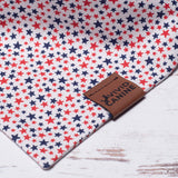 white dog bandana with red and blue stars